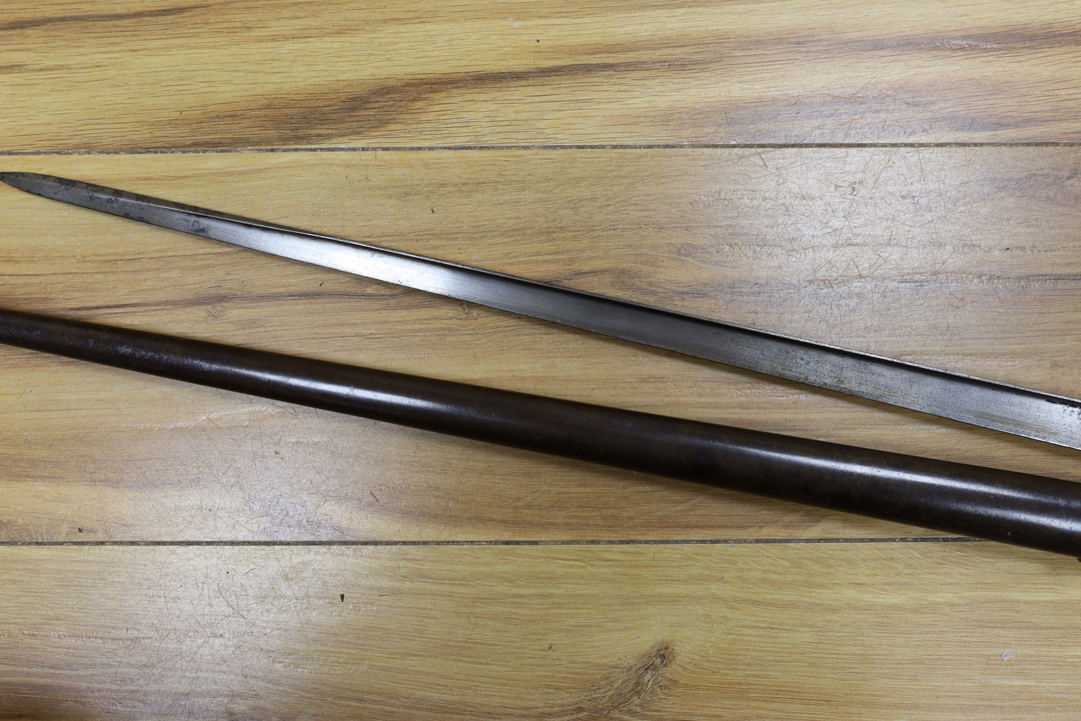 A Victorian officer's sword, lacking sheath, together with a 19th century French ’1877’ bayonet and sheath